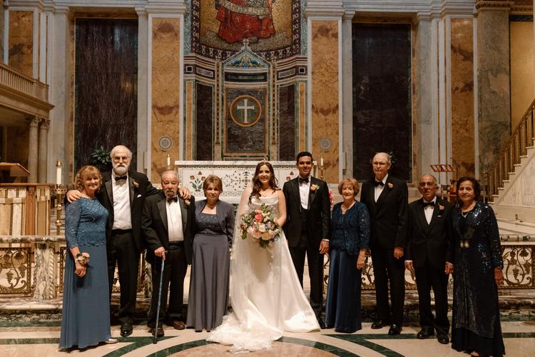 Sonia and Devan on their wedding day, with each of the  grandparents.